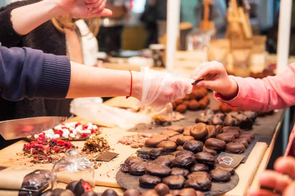 Chocolate tasting at St Christopher’s Berlin hostel, showcasing a variety of handmade chocolates and.