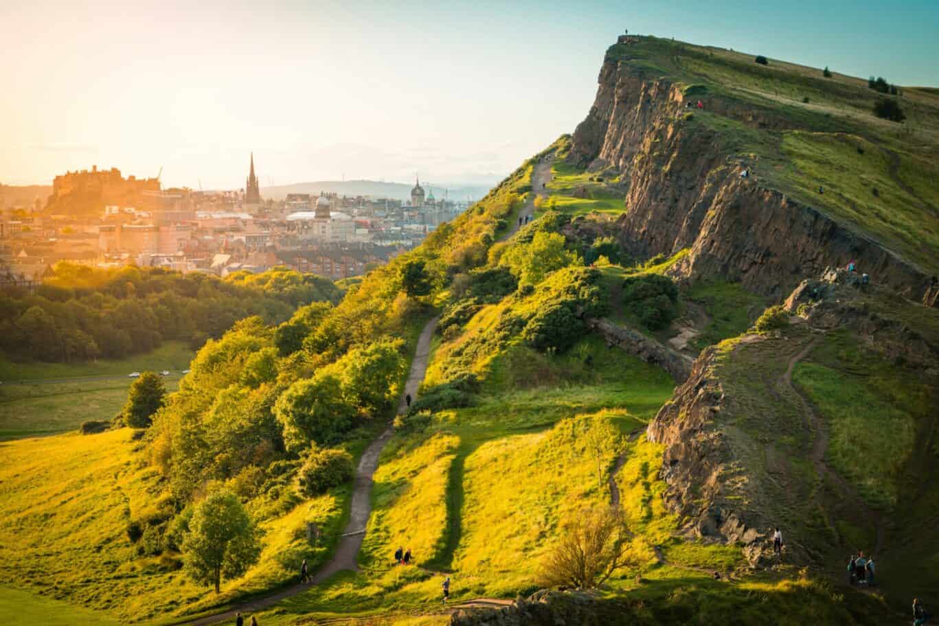 View of Edinburgh Castle from Castle Hill, with cityscape and green slopes, at St Christopher's Inns.