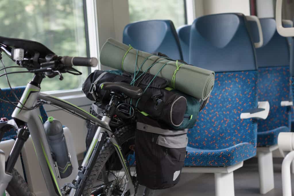Bike with camping gear on a train seat in Berlin - Mitte.