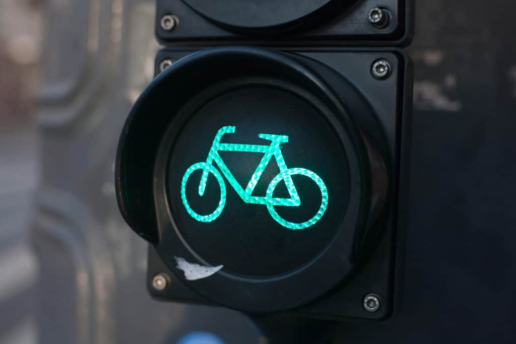 Bike lane traffic light in Berlin, Germany, indicating it is safe for cyclists to proceed.