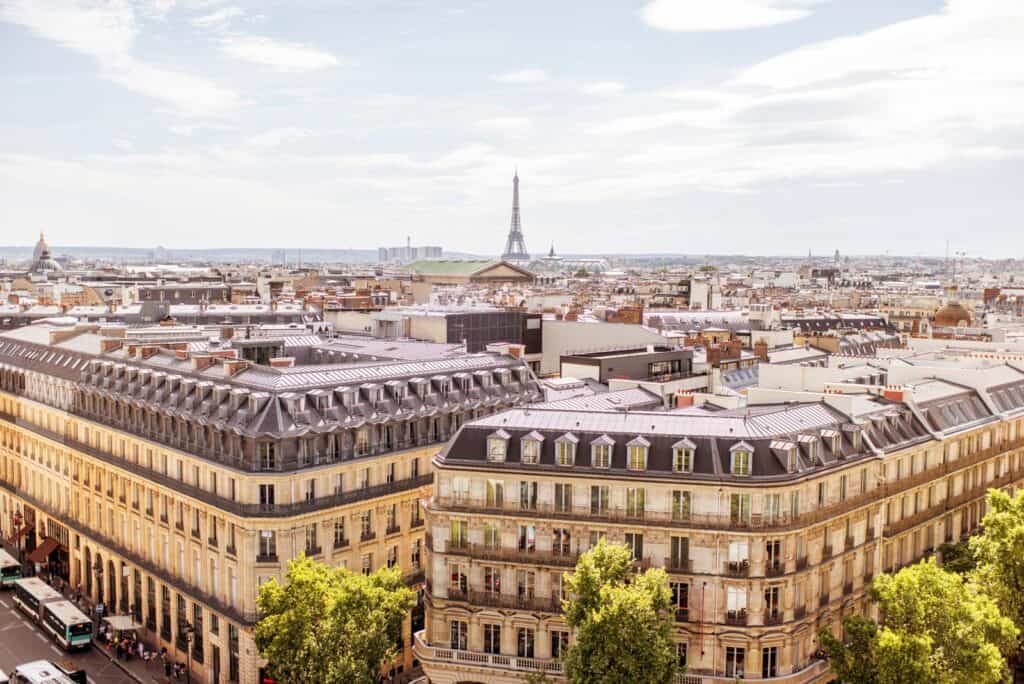 Panoramic view of central Berlin with Eiffel Tower replica in the distance.
