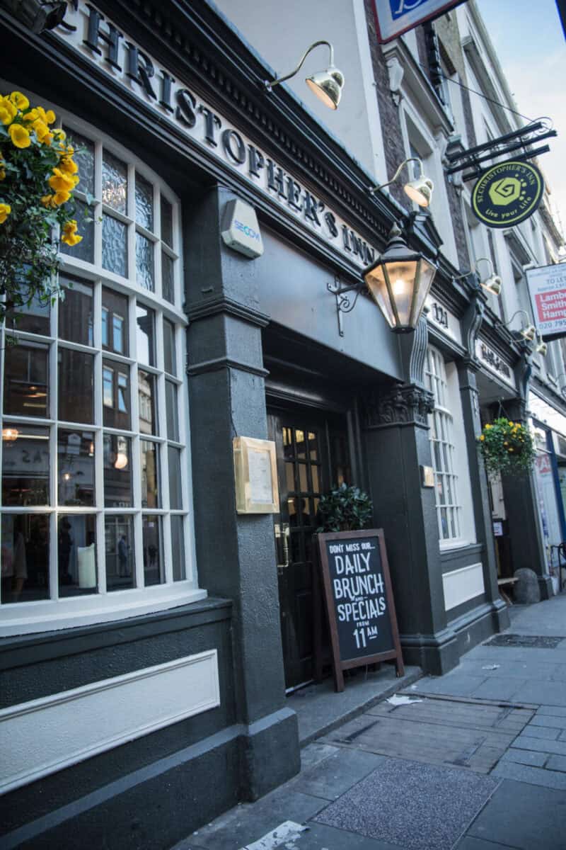 Exterior view of a St Christopher's Inn hostel with signage and hanging lamps.