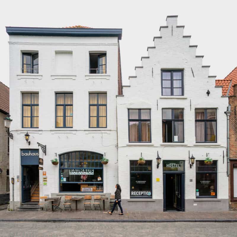 A street view of a hostel building with a bar and reception area.