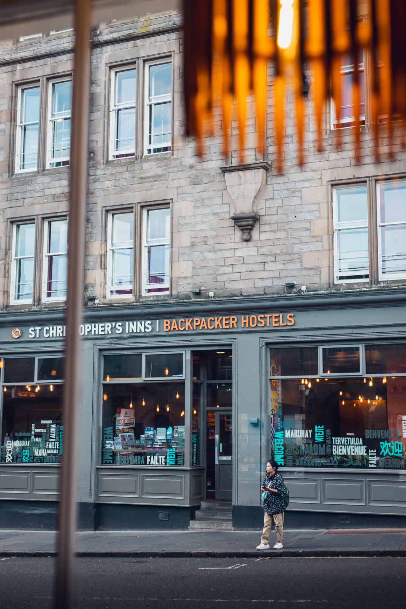 Exterior view of a St Christopher's Inn hostel with a bar and large windows.