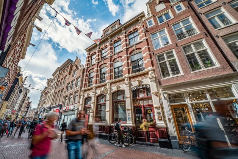 Historic building on a lively city street in London, featuring traditional architecture and vibrant.