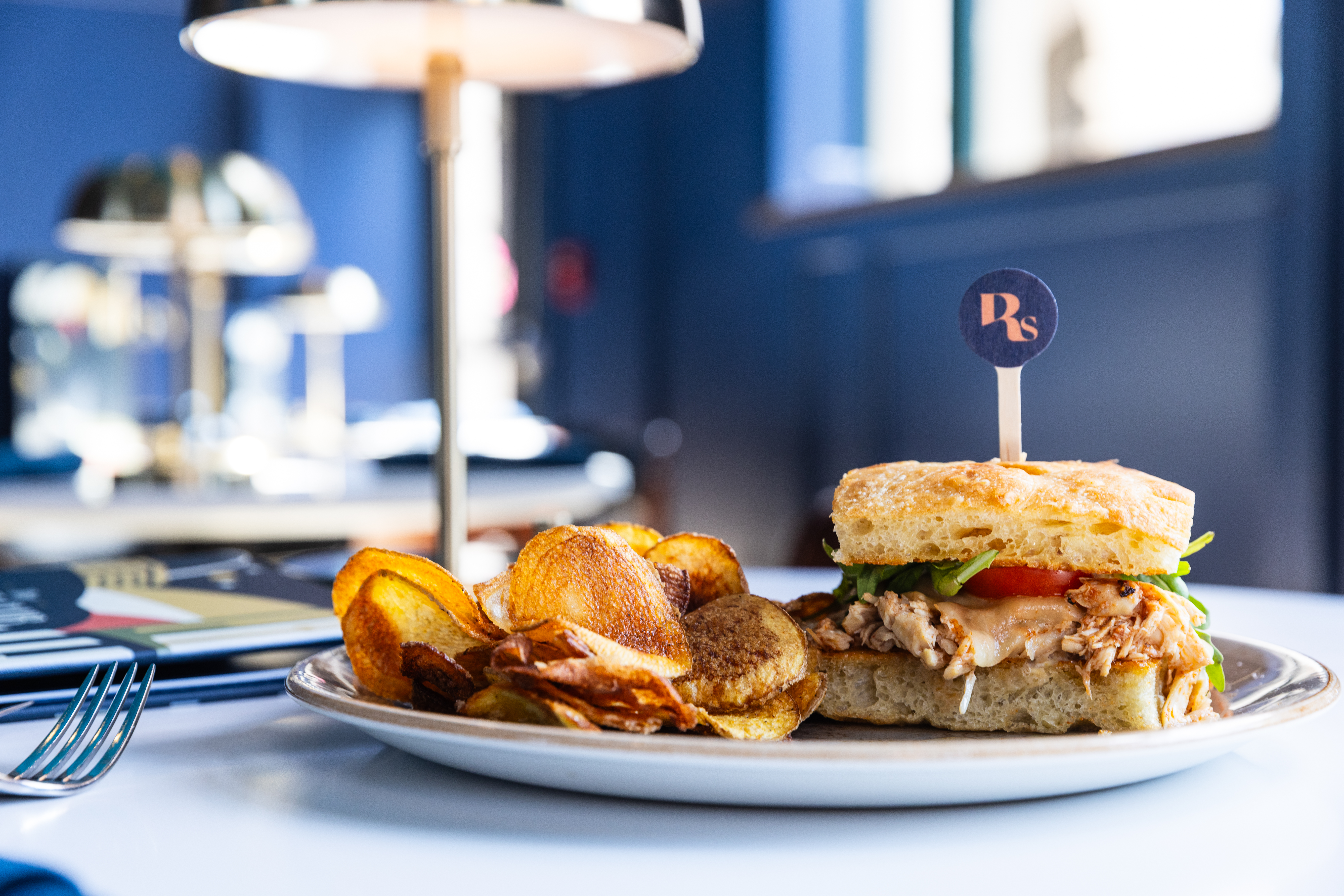 photo of a burger and chase club in the background