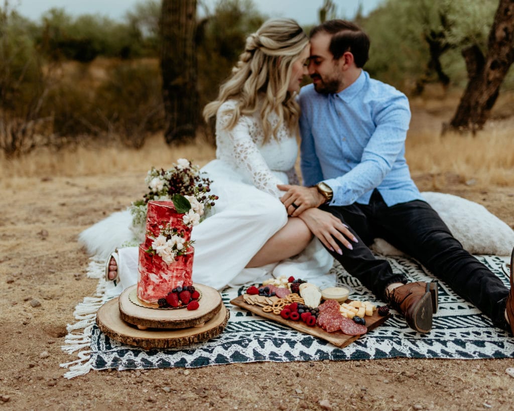 Enjoying a sunset picnic is one of the fun elopement ideas you can include in your elopement