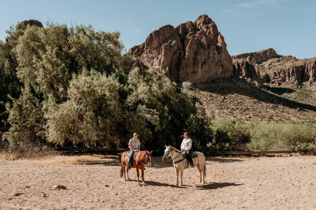 Couple on horseback during their Arizona elopement by Stratus Photography