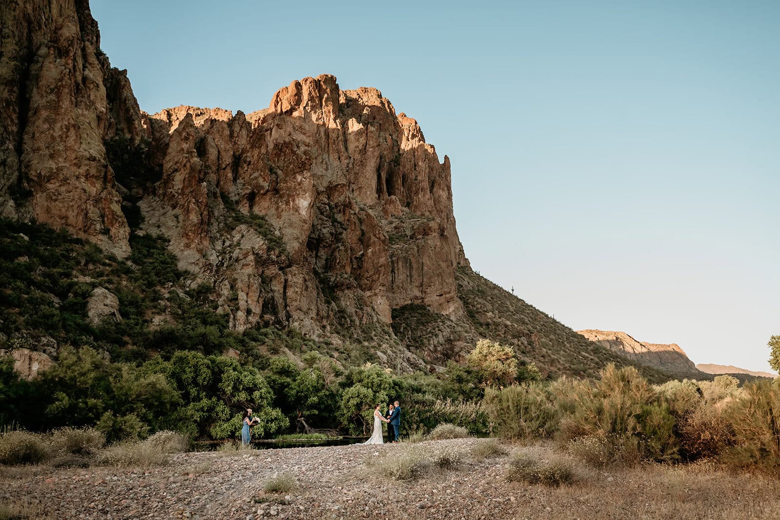 Sunrise begins to light up the Bulldog Canyon walls during Phoenix elopement ceremony, shot by Stratus Adventure Photography