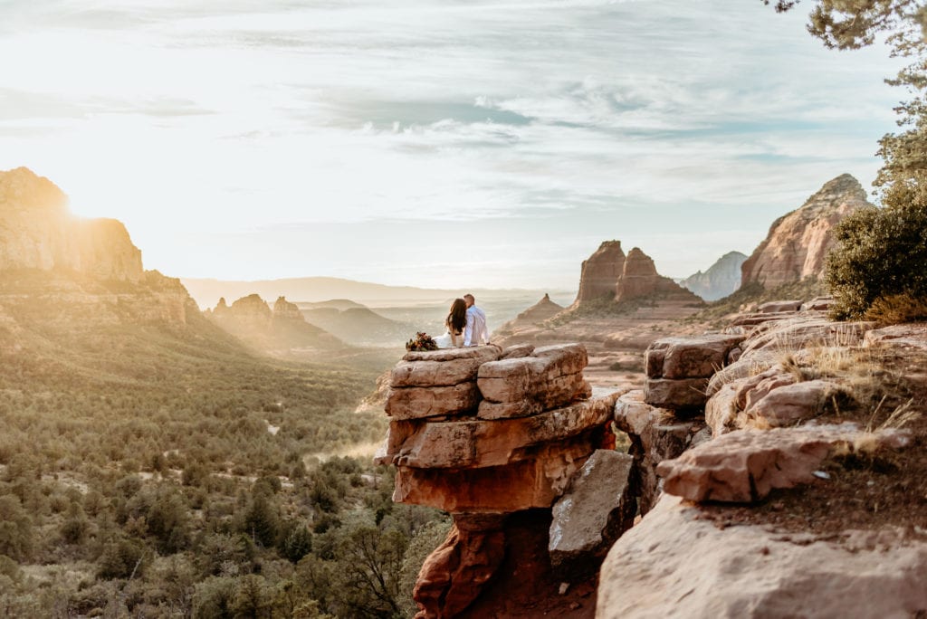 Merry Go Round Rock wedding couple enjoying the sunset overlooking Sedona