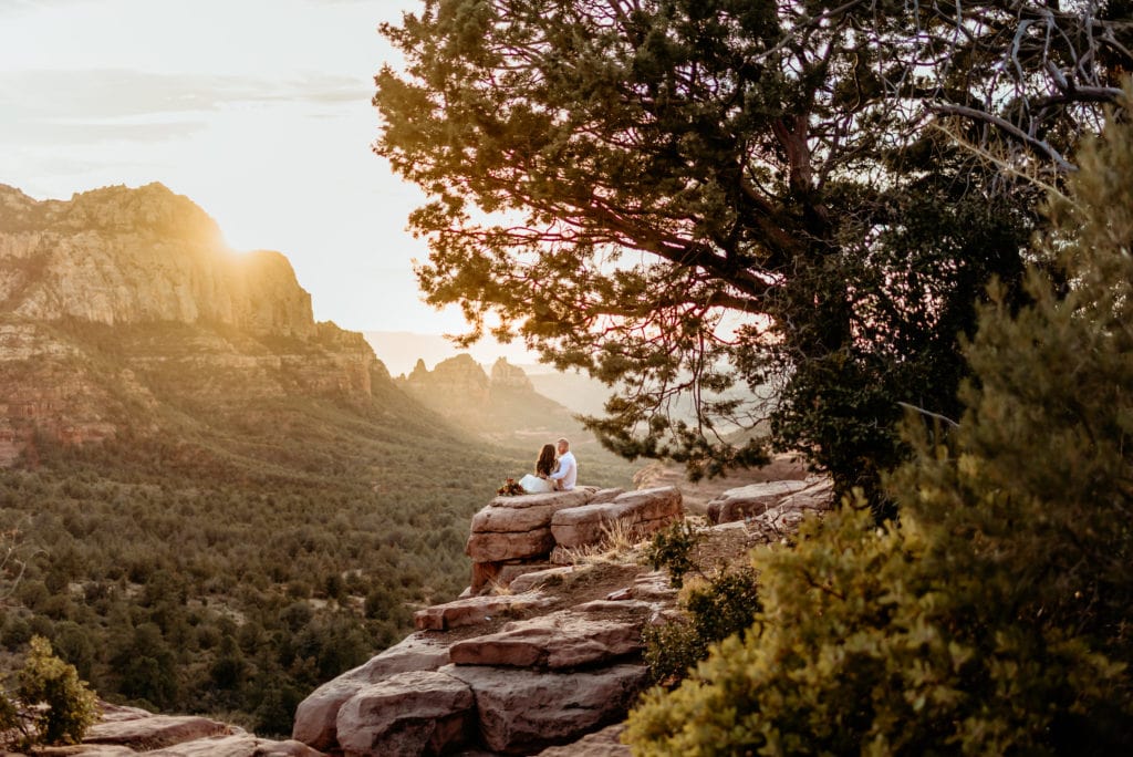Elopement couple enjoying the sunset at Merry Go Round Rock