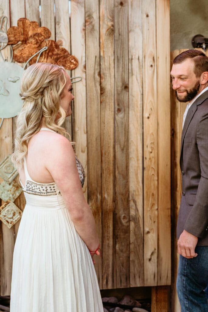 Groom turning around to see bride for the first time on their elopement day