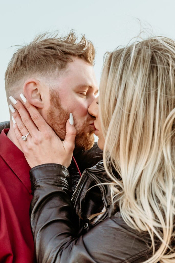 Cassie drawing Nick in for a romantic kiss