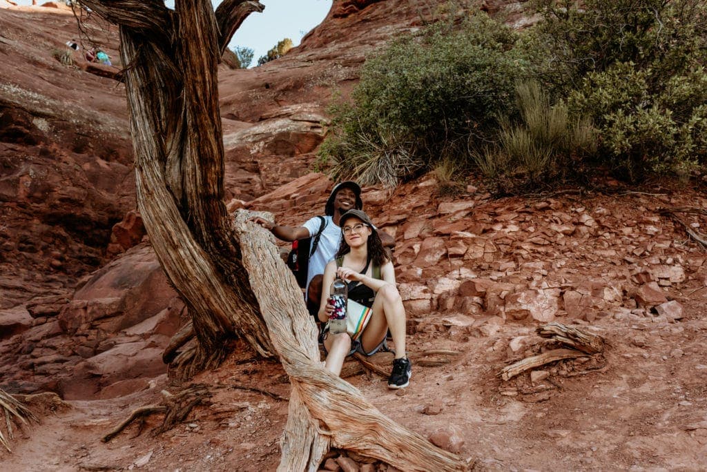 Couple taking a break on their hike to the top of Cathedral Rock