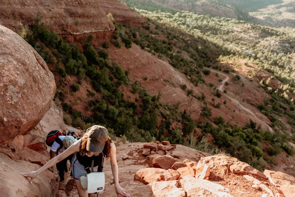 Couple climbing to the summit of Cathedral Rock