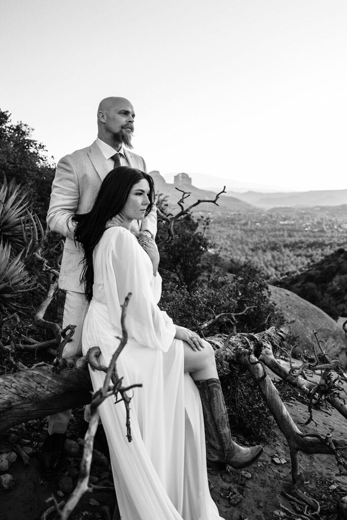 Black and white image of couple with Cathedral Rock in the Background by Sedona Elopement Photographer Stratus Adventure Photography