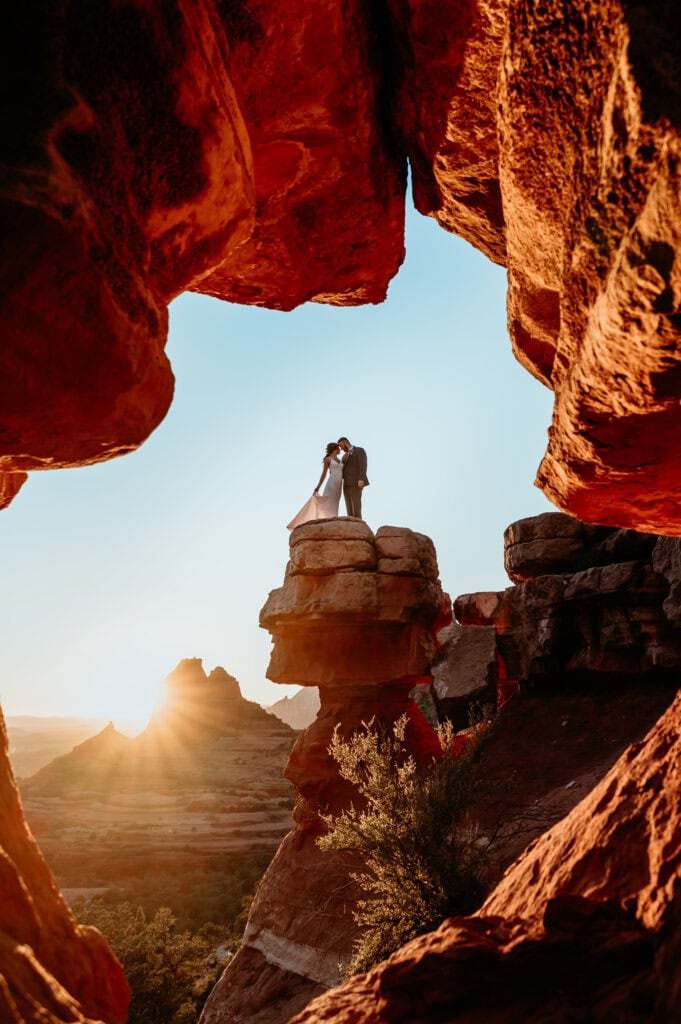 Couple embracing at Merry Go Round for their Arizona elopement in Sedona by Stratus Photography