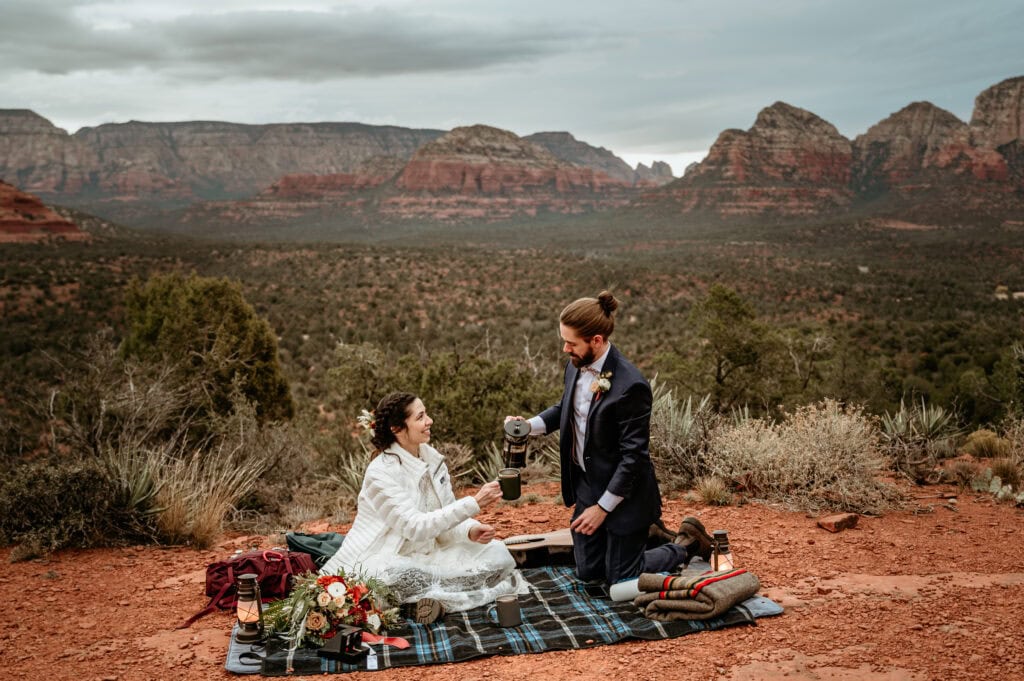 groom pouring coffee for bride during their Sedona elopement by Sedona Wedding Photographer