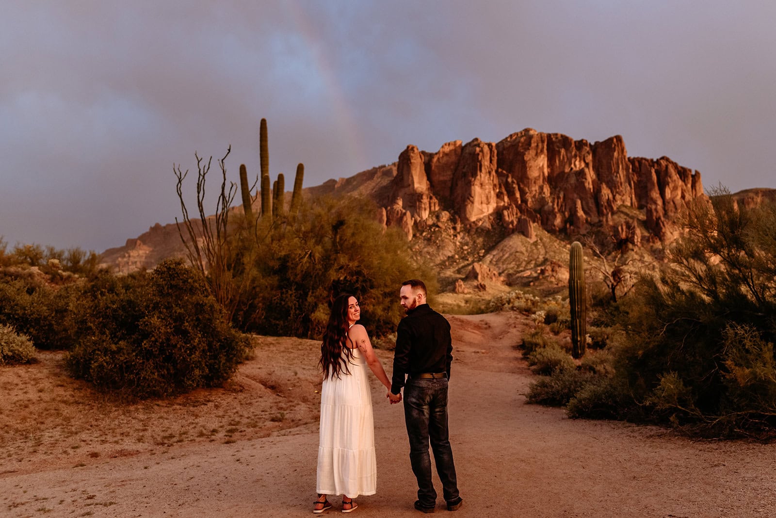 Couple during vibrant monsoon sunset during their Phoenix elopement, shot by Stratus Adventure Photography