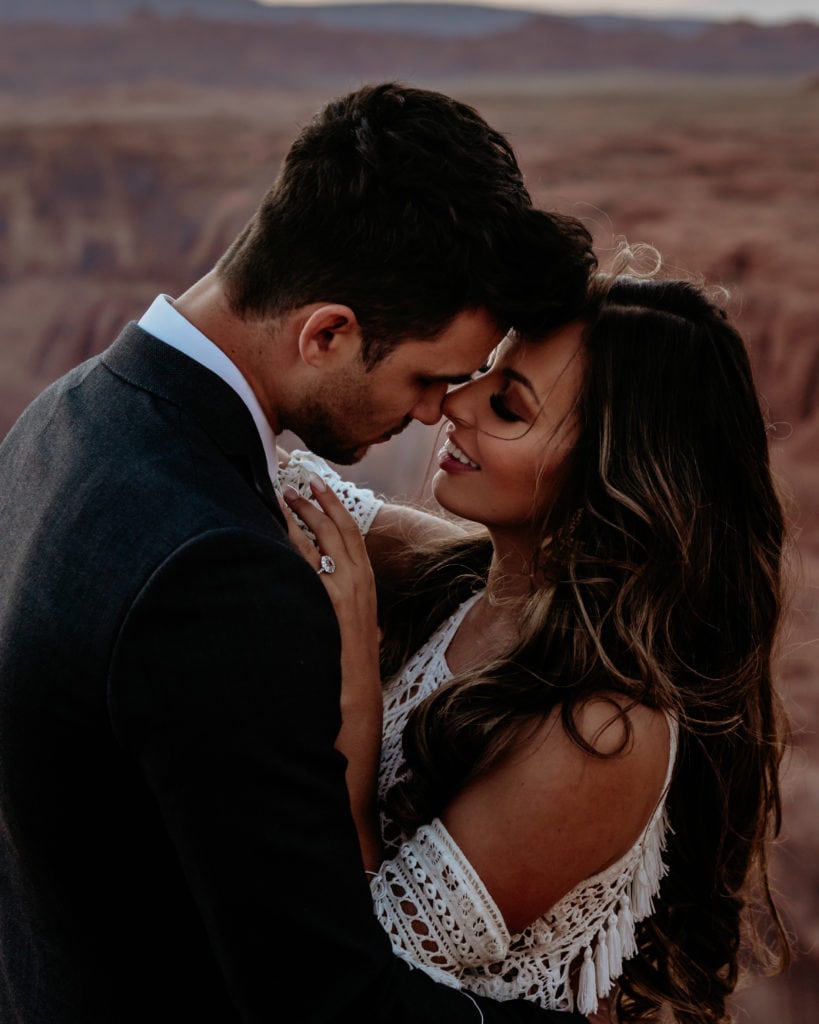 Bride smiles at groom during desert elopement