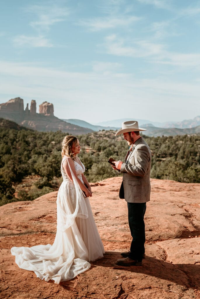Couple saying their vows in the red rocks of Sedona during their elopement ceremony