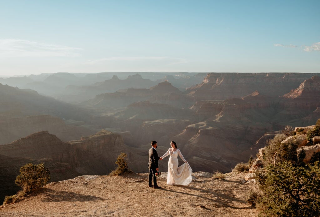 Couple dancing on Grand Canyon rim during Arizona elopement captured by Stratus Adventure Photography