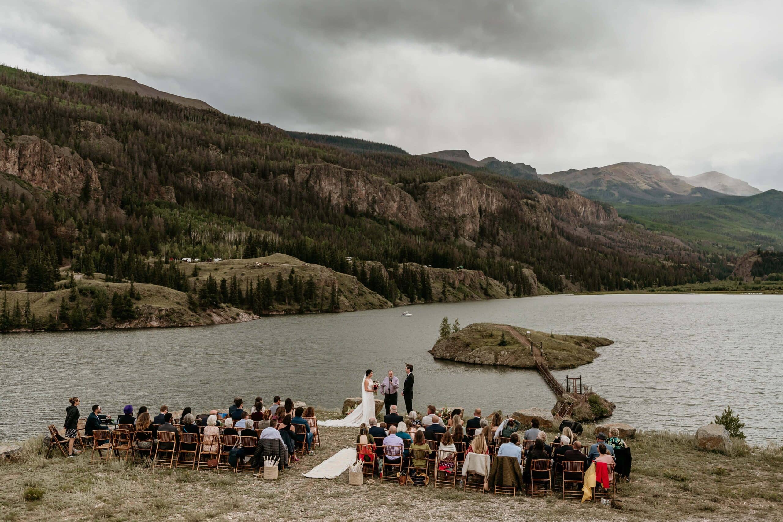 Wedding ceremony overlooking an alpine lake photographed by San Juan Mountains Wedding Photographer Shannon Durazo