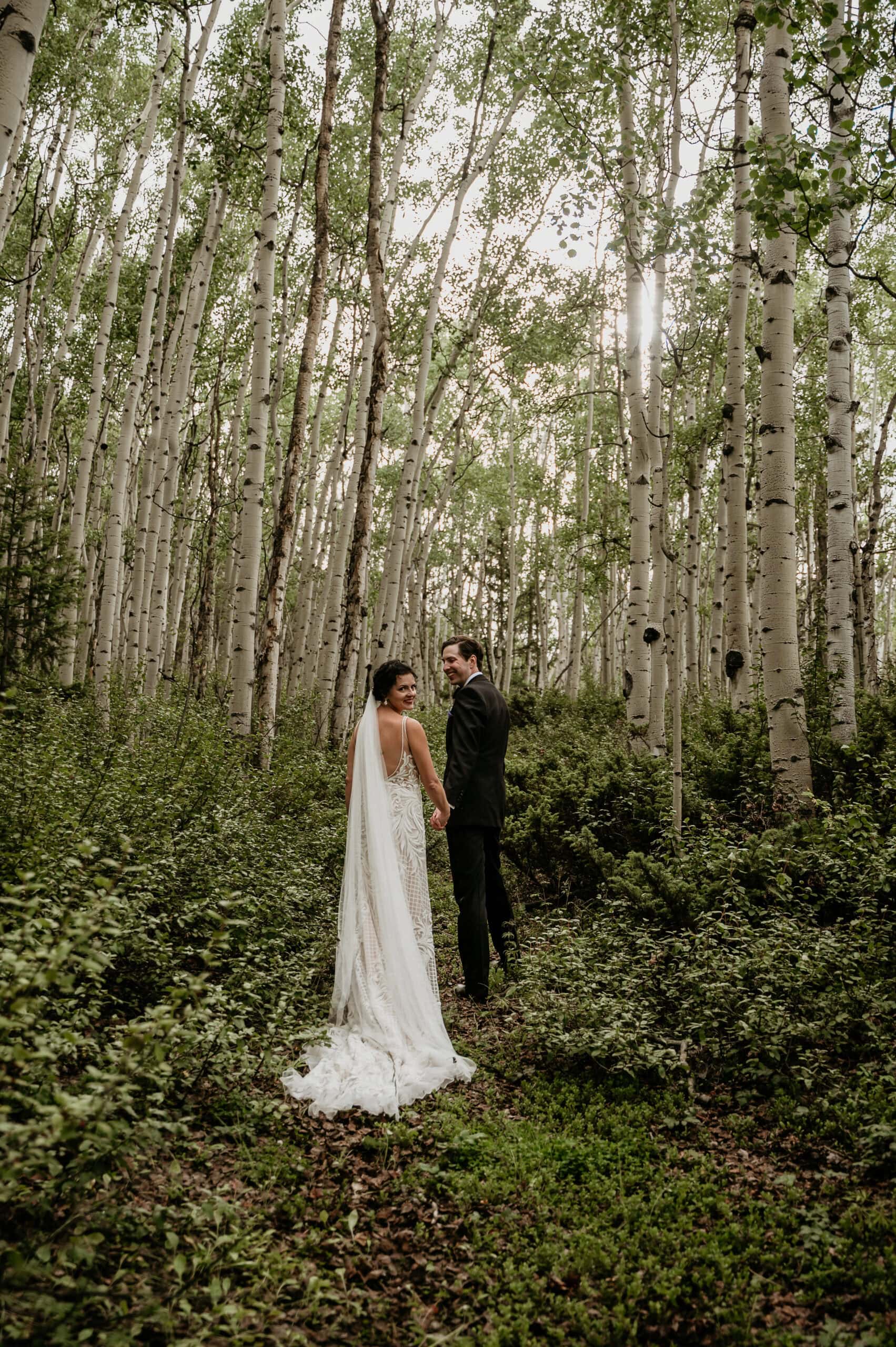 Couple surrounded by aspen trees in San Juan Mountains, photographed by San Juan Mountains Elopement Photographer Shannon Durazo