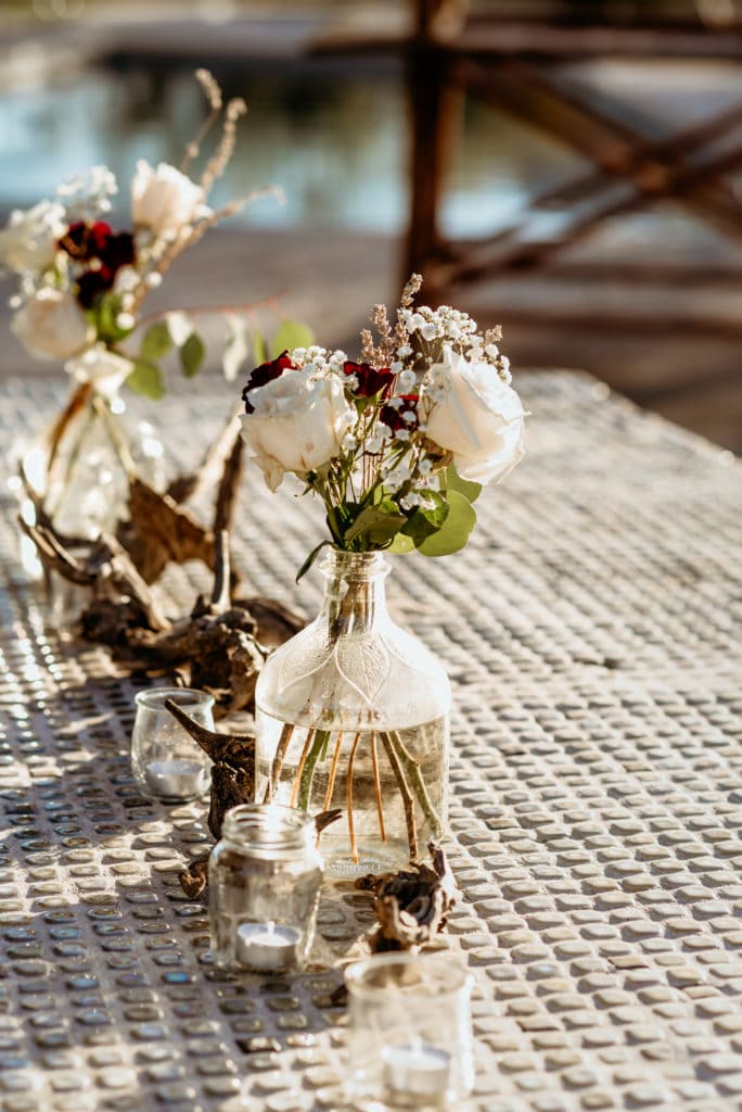 DIY floral arrangements on the buffet table during this Wranglers Roost intimate wedding ceremony