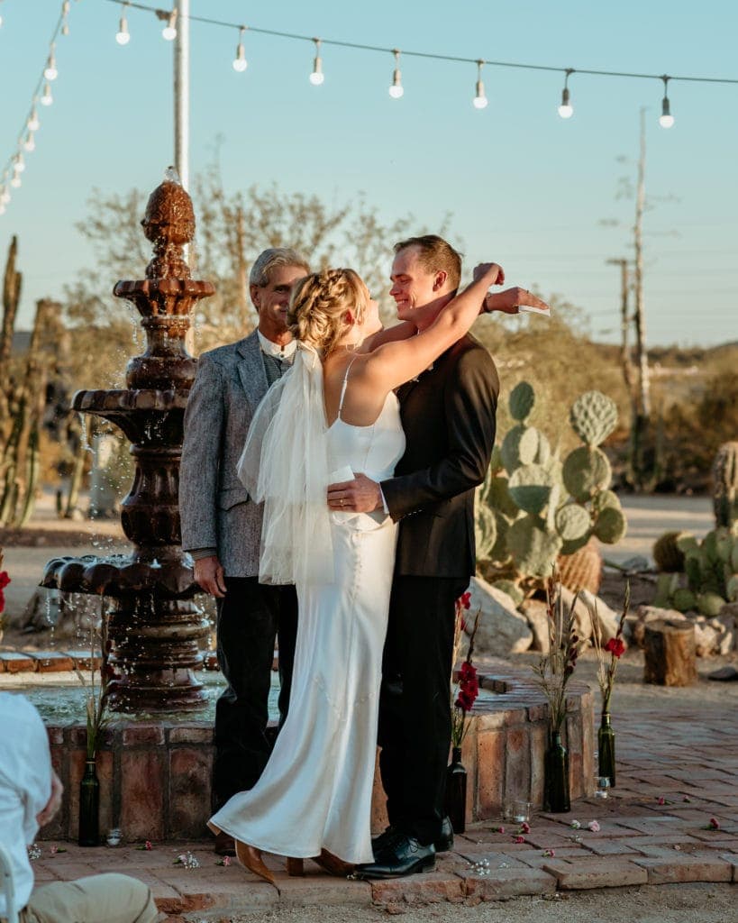Couple laughing after their first kiss during their New River wedding