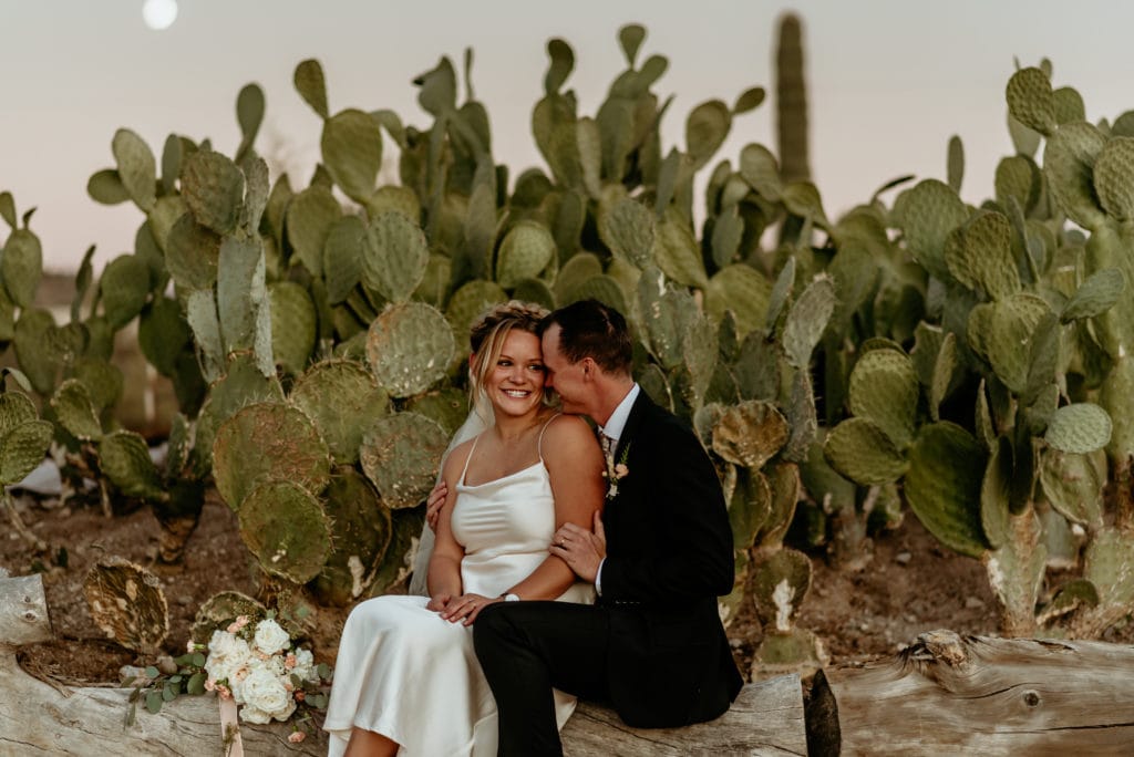 Bride and groom taking a moment to just be and be in the moment surrounded by the beauty of the Arizona desert