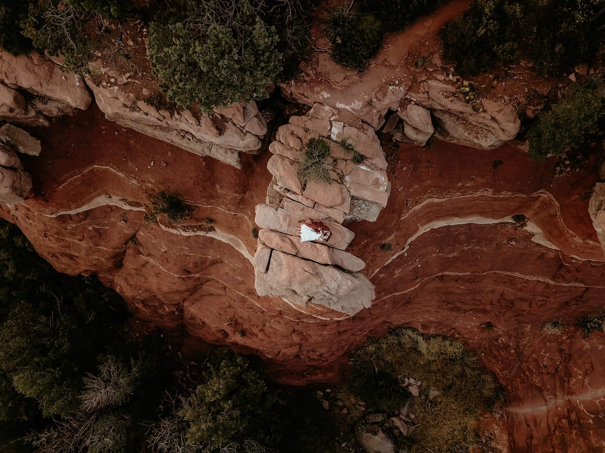 Overhead drone shot of a couple at the end of their off-road elopement day taken by Sedona elopement photographer