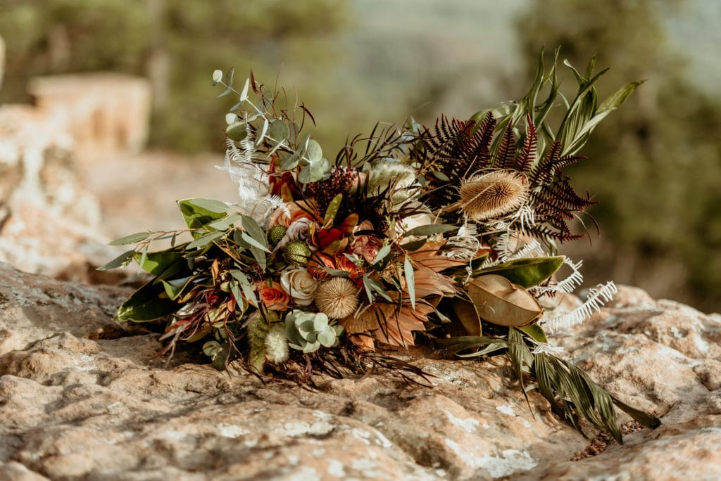 Unique boho wedding bouquet with funky textures and a mix of bold and earthy colors