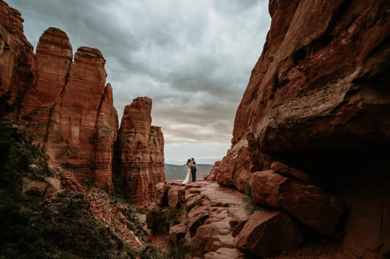 Couple on red rock at Sedona for Arizona elopement by Stratus Adventure Photography