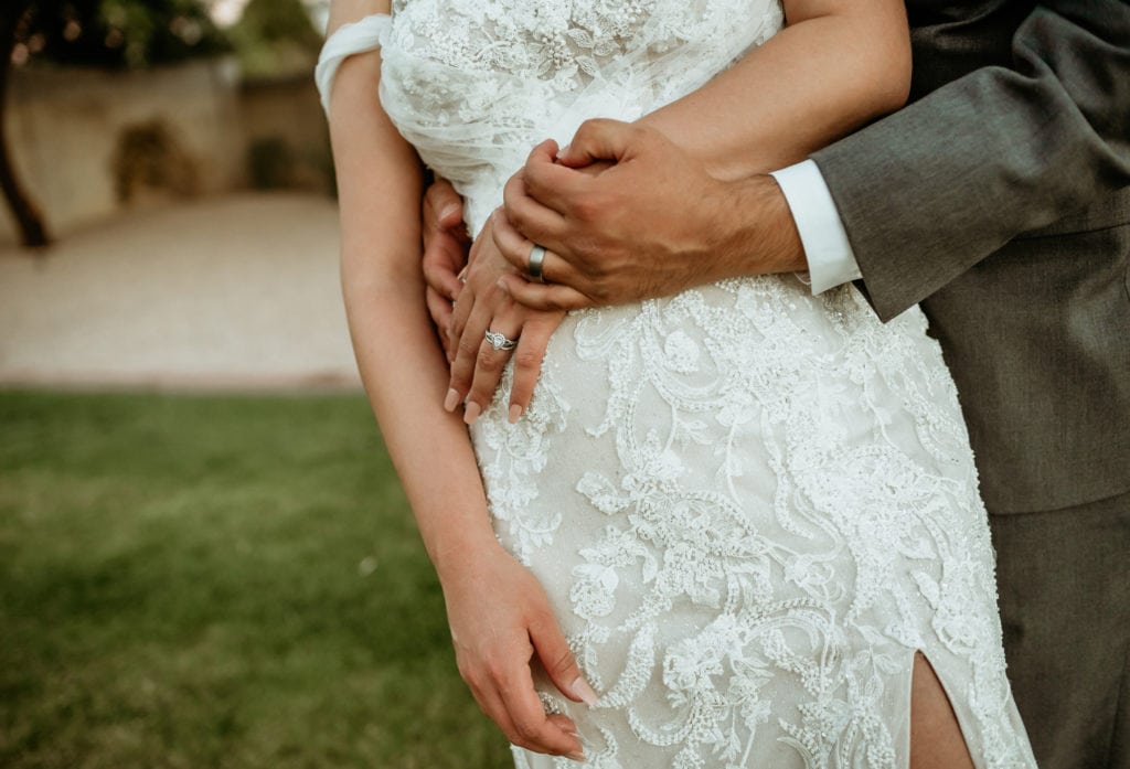 Hands holding with rings