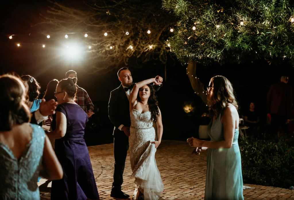 Bride and groom dancing at reception