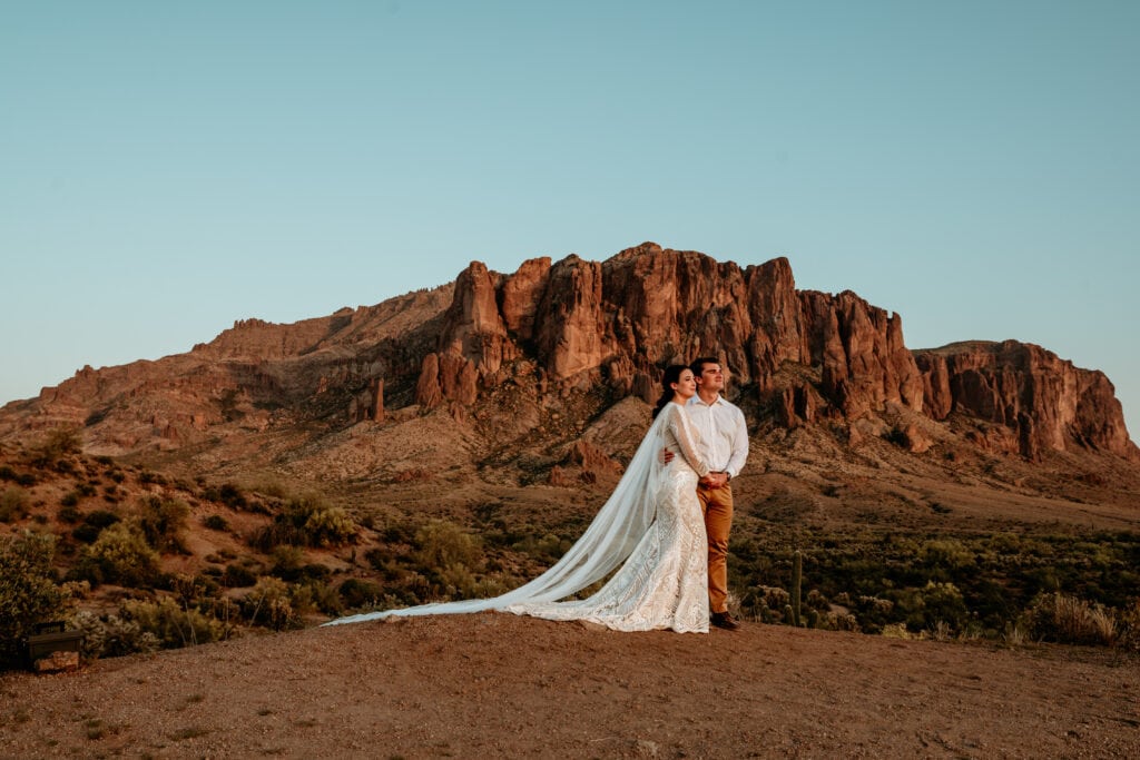 Couple at Superstition Mountains sunset for Arizona elopement by Stratus Photography