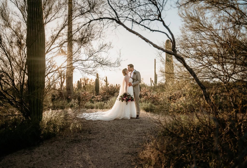 Couple under saguaros in Saguaro National Park for Arizona elopement