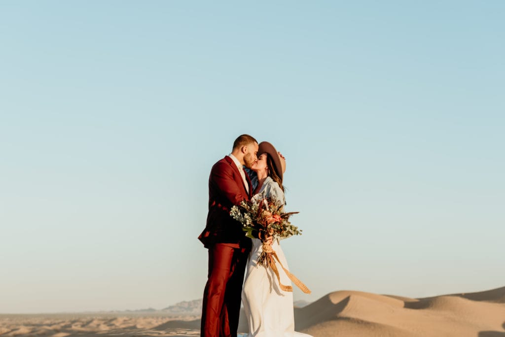 Boho couple in bold colors and minimalistic details during their Imperial Sand Dune wedding