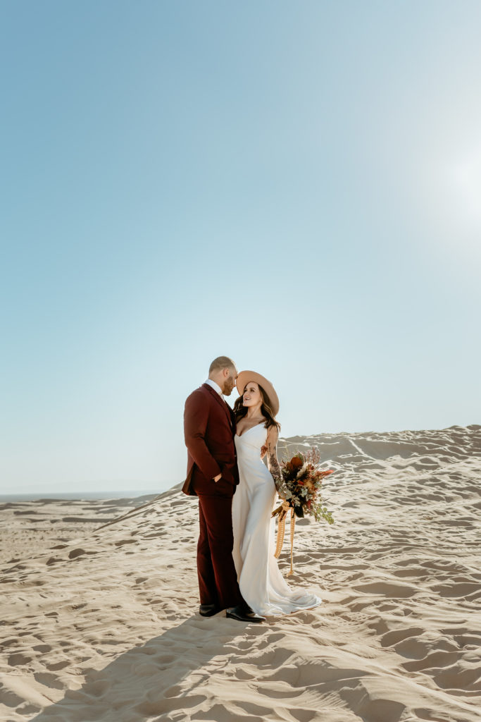 Couple gazing at each other at Glamis Sand Dunes