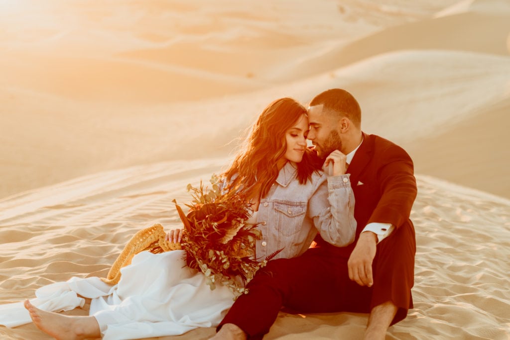 Golden light envelopes couple during their Sand Dune wedding