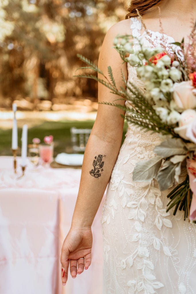 Bride's tattoo of a saguaro