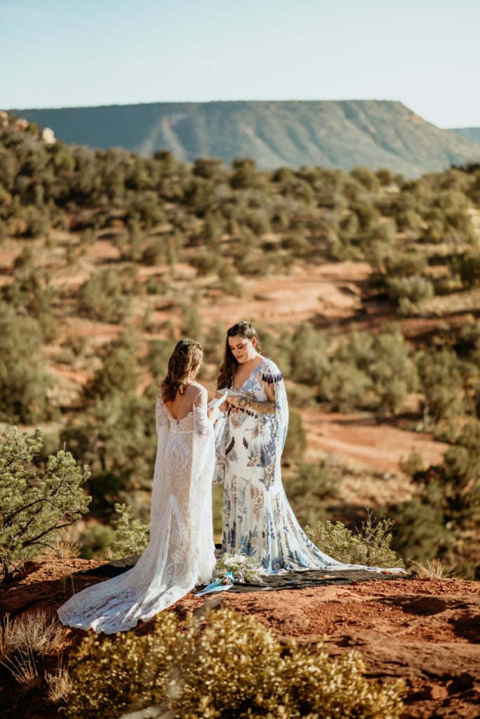 Brides saying their vows to each other during Courthouse vista wedding