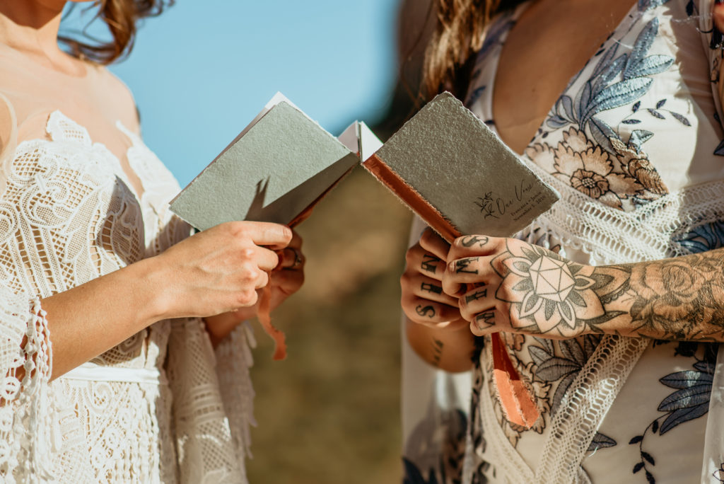 Vow books during Courthouse Butte elopement