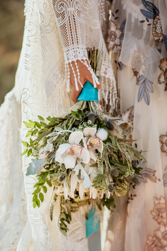 White orchid and lush green wedding bouquet