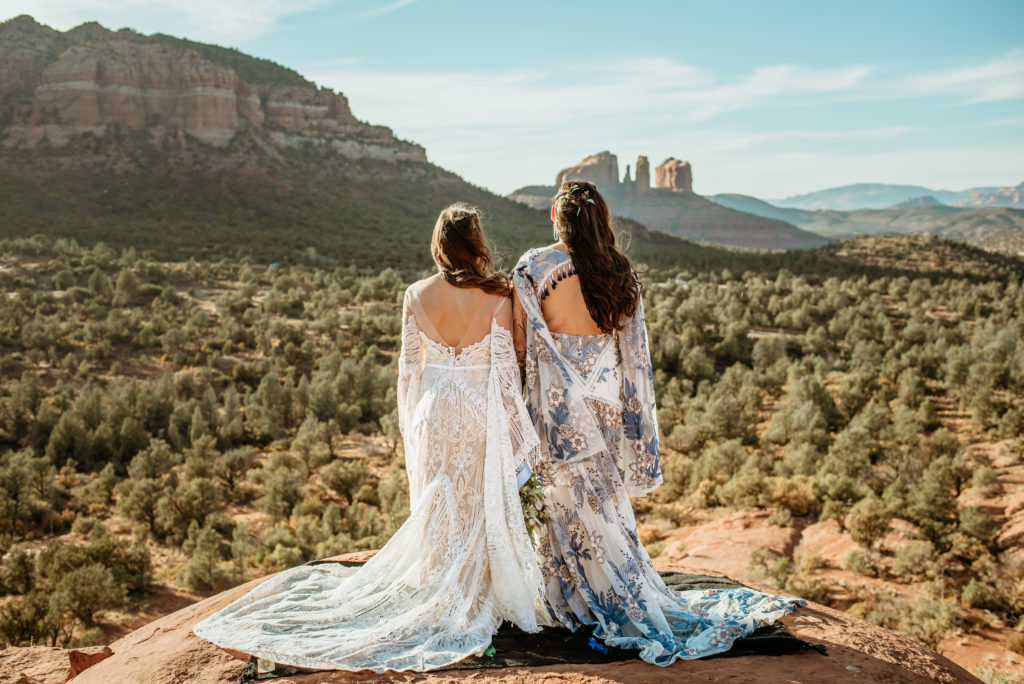 Gorgeous flowing Rue De Seine gowns on two brides during Baby Bell Rock elopement