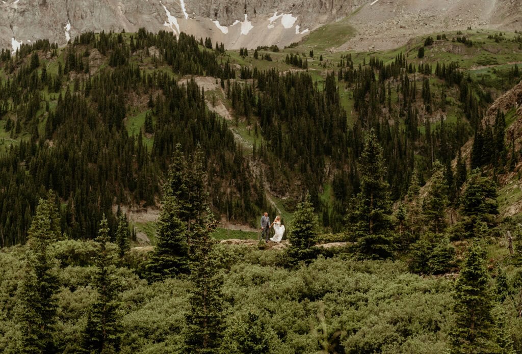Couple hikes along a ridgeline trail in San Juan Mountains, photographed by San Juan Mountains Elopement Photographer Shannon Durazo