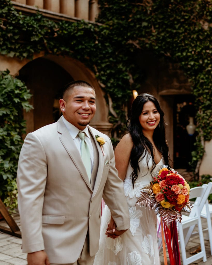 Latino couple walking back down the isle of their Tlaquepaque wedding
