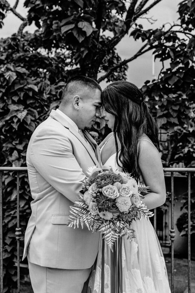 Bride and groom taking a moment on the Tlaquepaque balcony