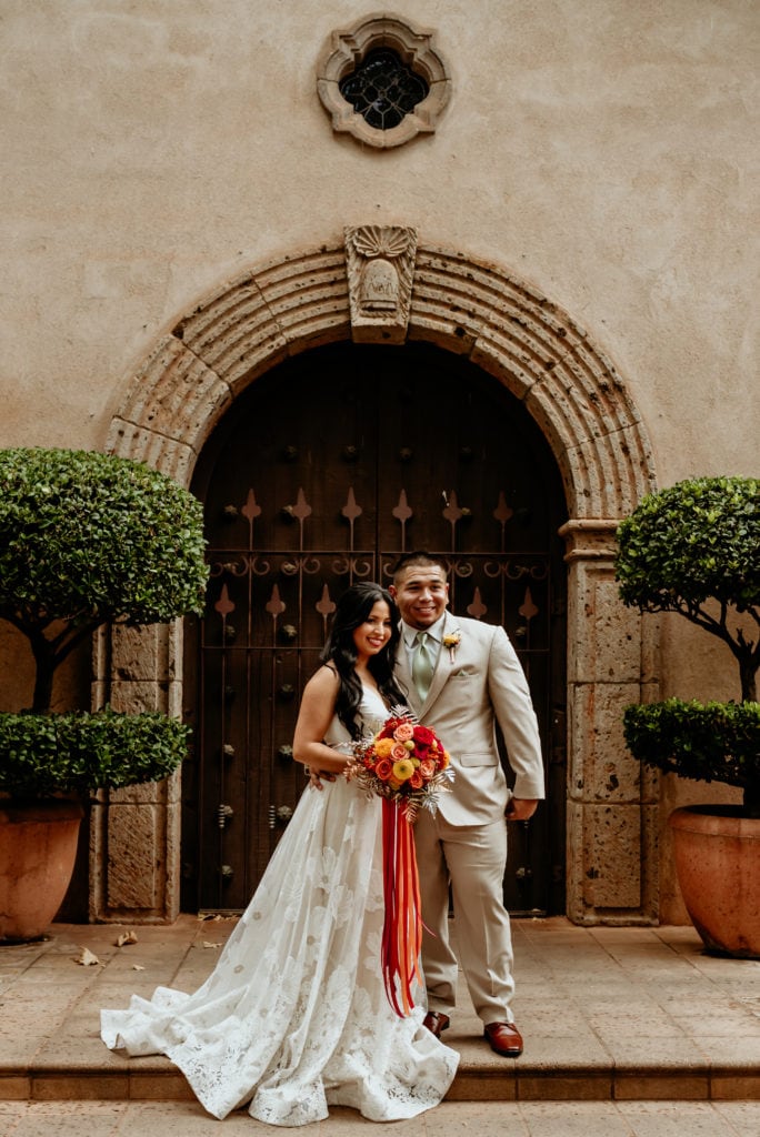 Bride and groom in front of the Tlaquepaque chapel doorway